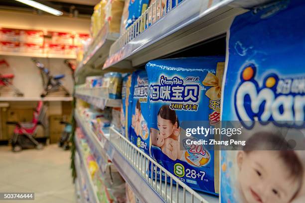 Baby paper diaper area in a supermarket. China will have as many as eight million extra new babies each year after the abolition of the controversial...