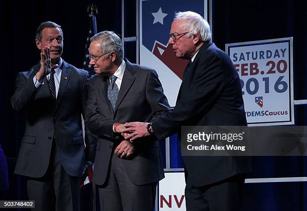 Democratic Presidential candidates Martin O'Malley and Sen. Bernie Sanders on stage with Senate Minority Leader Harry Reid prior to the Battle...