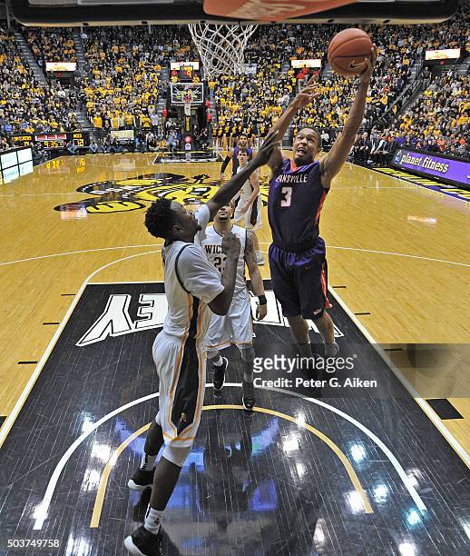 Guard Jaylon Brown of the Evansville Aces drives to the basket against the Wichita State Shockers during the first half on January 6, 2016 at Charles...