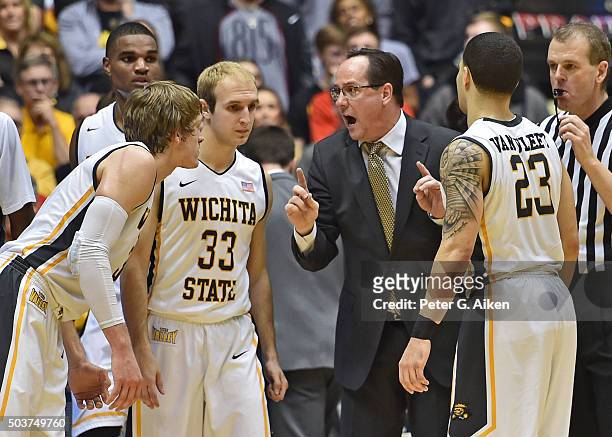 Head coach Gregg Marshall of the Wichita State Shockers talks with players Fred VanVleet, Conner Frankamp and Ron Baker during a time out against the...