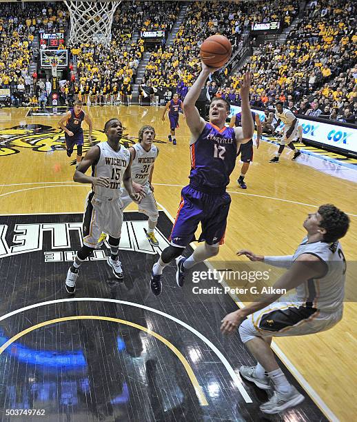 Guard Adam Wing of the Evansville Aces drives to the basket against the Wichita State Shockers during the first half on January 6, 2016 at Charles...
