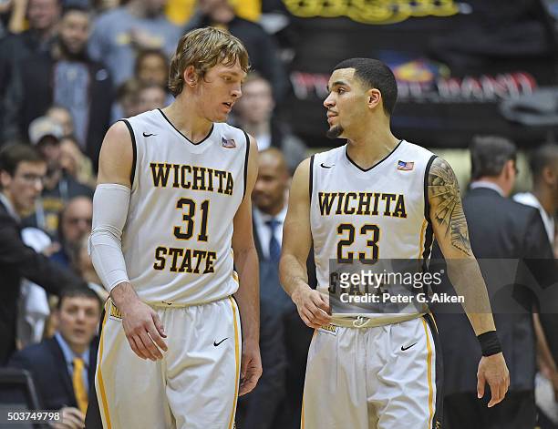 Guard Fred VanVleet of the Wichita State Shockers talks with teammate Ron Baker during the second half against the Evansville Aces on January 6, 2016...