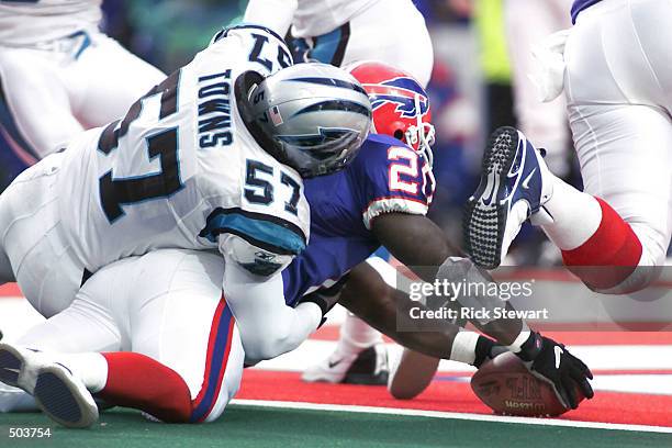 Travis Henry of the Buffalo Bills breaks the plane of the goalline with the ball as he scores the winning touchdown against the Carolina Panthers...