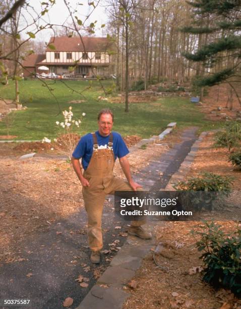 Kemble Matter, a gym teacher and Dell computer stockholder, in the wooded backyard of his home.