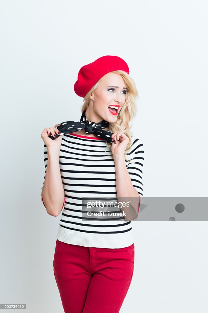 Blonde french woman wearing red beret