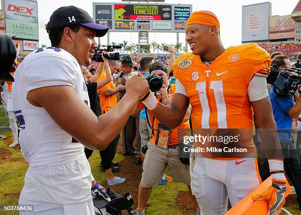 Joshua Dobbs of the Tennessee Volunteers is congratulated by Lloyd Yates of the Northwestern Wildcats after the Outback Bowl at Raymond James Stadium...