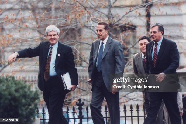 Congressional leaders House Speaker Newt Gingrich , Senate Majority Leader Bob Dole & Rep. Dick Armey arriving at White House for budget talks.