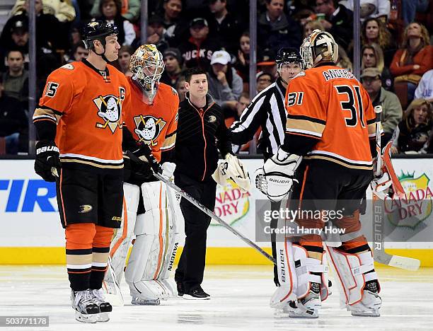 John Gibson of the Anaheim Ducks leaves the ice as he is replaced after an injury by Frederik Andersen as Ryan Getzlaf of the Anaheim Ducks watches...