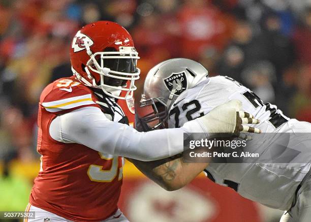 Linebacker Tamba Hali of the Kansas City Chiefs rushes against offensive tackle Donald Penn of the Oakland Raiders during the second half on January...