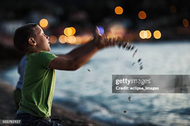 Child Throwing Rocks Kid Throwing Stone Photos and Premium High Res Pictures - Getty Images