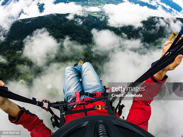 paraglider's point of view, flying over the clouds - paragliding bildbanksfoton och bilder