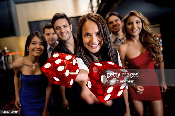 group of people at the casino - casino worker stockfoto's en -beelden