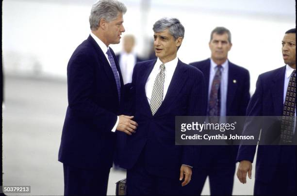 Treasury Secy. Robert Rubin & Pres. Bill Clinton chatting on tarmac at JFK Airport .