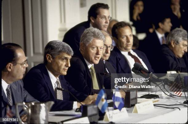 Pres. Bill Clinton at IMF event, flanked by Treasury Secy. Robert Rubin & Federal Reserve chmn. Alan Greenspan .