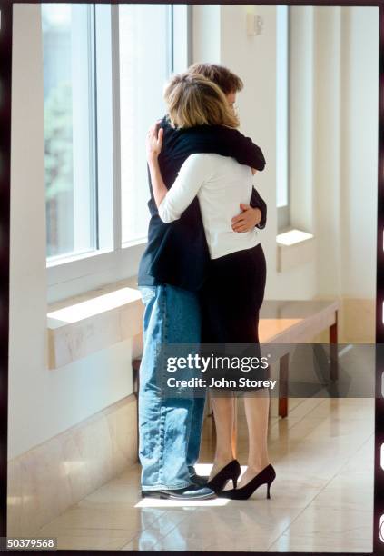 Comedian Dana Carvey hugging his wife Paula.