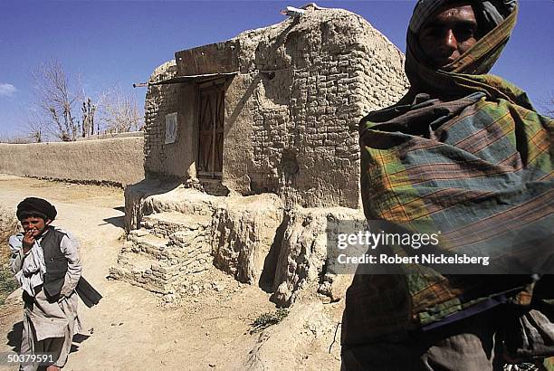 Taliban outside village where ruling Islamic movement's supreme leader Mullah Mohammed Omar lived & studied during Soviet occupation.