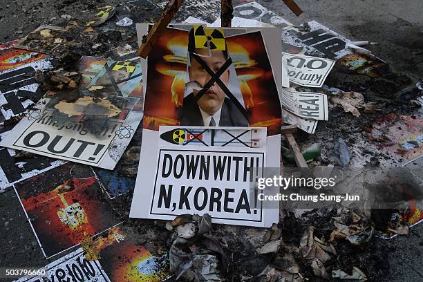 South Korean protesters burn placards of North Korean leader Kim Jong-Un during a anti-North Korea rally on January 7, 2016 in Seoul, South Korea....