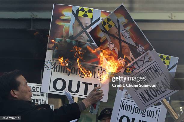 South Korean protesters burn placards of North Korean leader Kim Jong-Un during a anti-North Korea rally on January 7, 2016 in Seoul, South Korea....