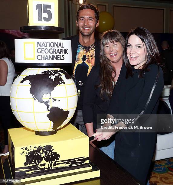 Television host Jason Silver, television star Sue Aikens, and Courteney Monroe, CEO, National Geographic Channel, cuts the cake for National...