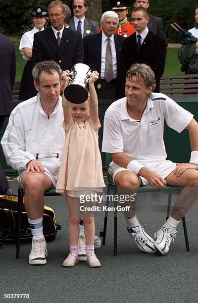 Tennis player John McEnroe w. DaughterAnna & opponent Bjorn Borg at charity tennis event at Buckingham Palace for the National Society for the...