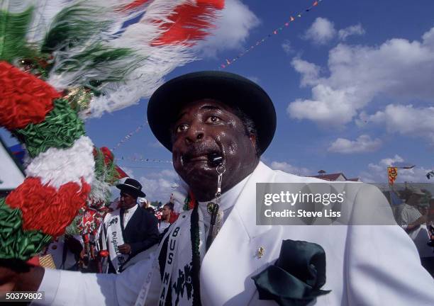 Celebrants parading at fairgrounds in all-day festivities during New Orleans Jazz Festival in scene from TIME cover story Life on the Mississippi.