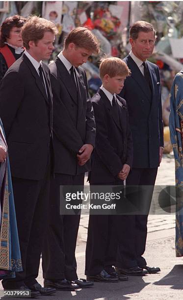Charles Spencer, Prince William, Prince Harry and Prince Charles standing together outside Westminster Abbey during funeral of Princess Diana.