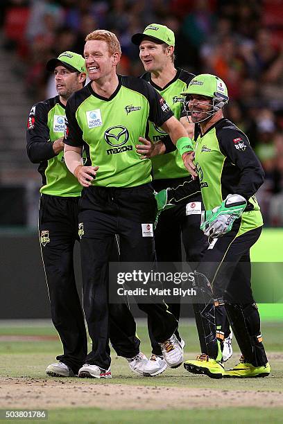 Andrew McDonald of the Thunder celebrates the wicket of Shaun Marsh of the Scorchers during the Big Bash League match between the Sydney Thunder and...