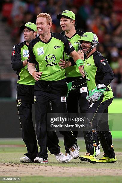 Andrew McDonald of the Thunder celebrates the wicket of Shaun Marsh of the Scorchers during the Big Bash League match between the Sydney Thunder and...
