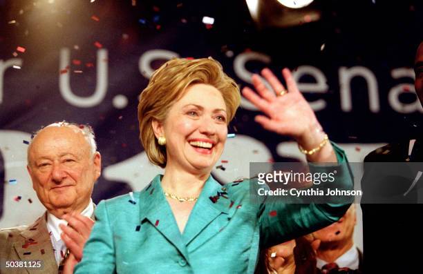 Senator-elect Hillary Rodham Clinton celebrating her victory at election night party at Grand Hyatt, with Ed Koch behind her.