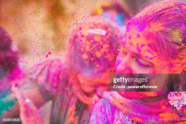 color explosion at holi festival in india - colour powder explosion stockfoto's en -beelden