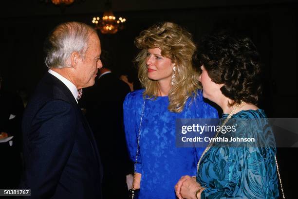 Oliver North's secy. Fawn Hall , figure in Iran-Contra scandal, w. Her mother Wilma and unident. At American Spectator dinner.