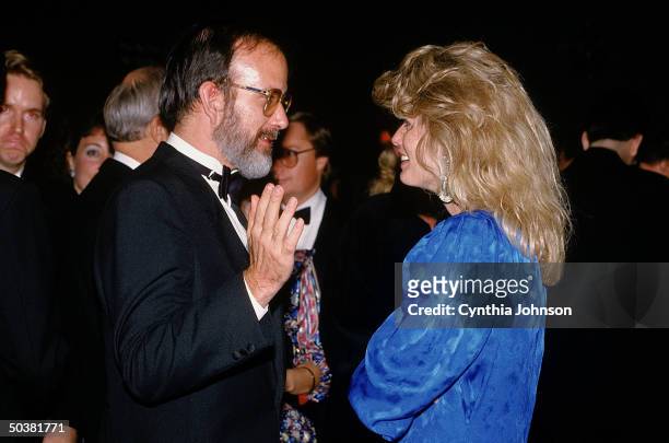 Oliver North's secy. Fawn Hall, figure in Iran-Contra scandal, w. Terrorist expert Michael Ledeen at American Spectator dinner.
