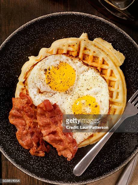 waffles with fried eggs and bacon - savoury food stock pictures, royalty-free photos & images