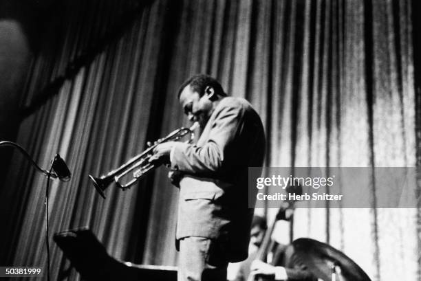 Jazz musician Miles Davis performing at the Apollo Theater.