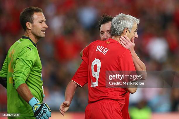 Clint Bolton of the Australian Legends watches on as Robbie Fowler and Ian Rush of the Liverpool FC Legends celebrate after Ian Rush scored a goal...
