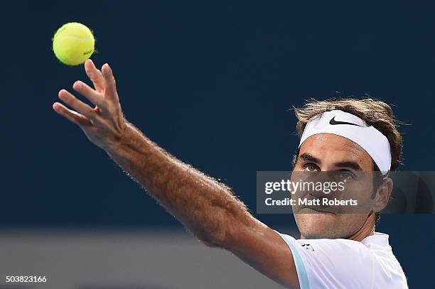 Roger Federer of Switzerland serves in his match against Tobias Kamke of Germany during day five of the 2016 Brisbane International at Pat Rafter...