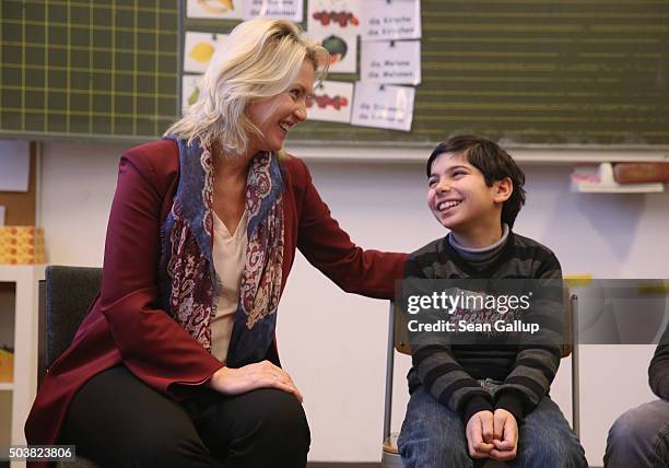 German Family Minister Manuela Schwesig greets Amar, a child participating in the "Welcome Class" for immigrant children, including children of...