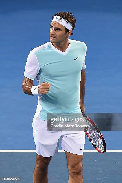 Roger Federer of Switzerland celebrates in his match against Tobias Kamke of Germany during day five of the 2016 Brisbane International at Pat Rafter...