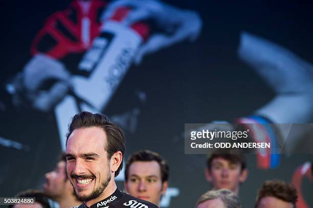 German rider John Degenkolb laughs as he presented during the launch of the 2016 Giant-Alpecin cycling team at the Italian embassy in Berlin on...