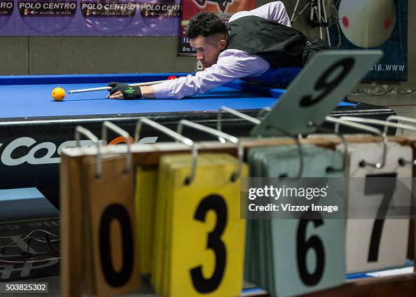 Pool Table Competitio A competitor plays on a pool table during the Three-cushion billiards ...