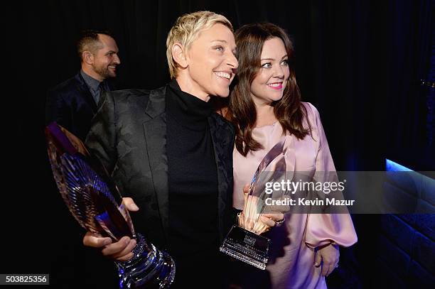 Comedian Ellen DeGeneres and actress Melissa McCarthy pose with awards during the People's Choice Awards 2016 at Microsoft Theater on January 6, 2016...