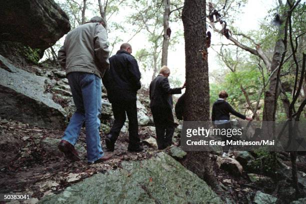 President George W. Bush , Russian President Vladimir Putin , First Lady Laura Bush and interpreter Irene Firsow walking a nature trail during a tour...