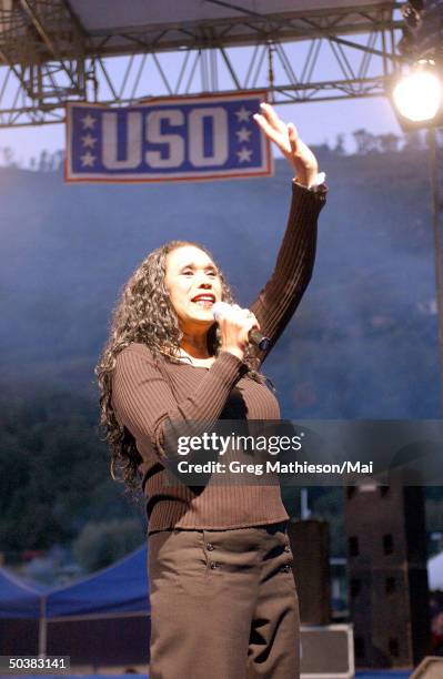 Singer Ruth Pointer, formerly of the Pointer Sisters, entertaining US Navy personnel during the USO Holiday Tour.