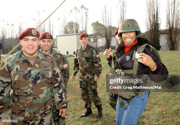 Singer Ruth Pointer , formerly of the Pointer Sisters, laughing after parachuting from a 5 story parachute practice tower at the US Army base as part...