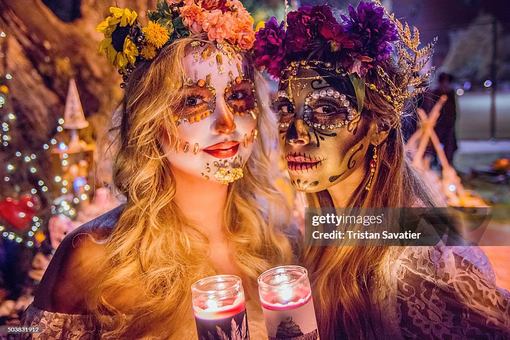 Women with sugar skull makeup at Dia de los Muertos procession