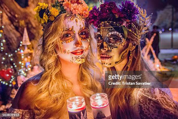 women with sugar skull makeup at dia de los muertos procession - sugar skull stock pictures, royalty-free photos & images