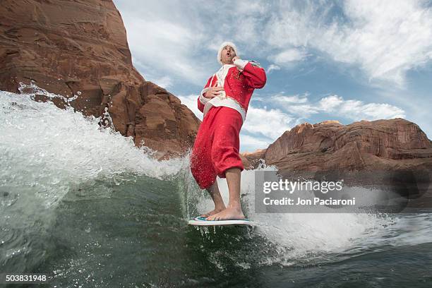 surfing santa in lake powell - surfing santa stock pictures, royalty-free photos & images