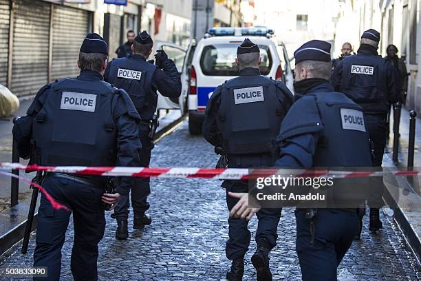 Armed police inspect the scene after a man was shot dead by police on January 7, 2016 in Paris, France. French A man was shot dead in Paris on...