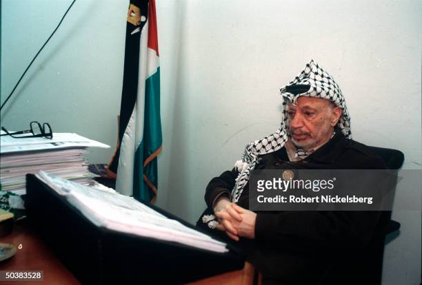 Palestinian leader Yasser Arafat in his office.