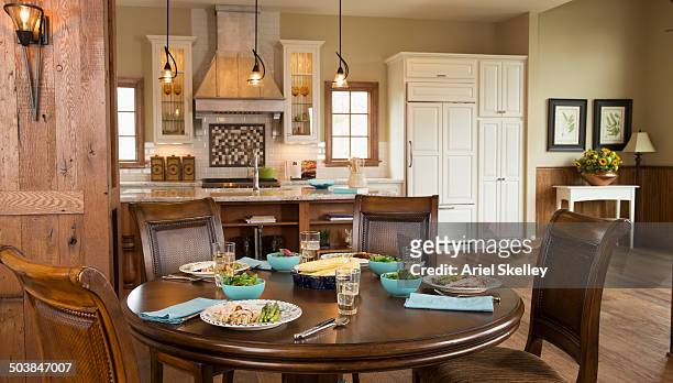 set table in open dining area - dining room set stock pictures, royalty-free photos & images